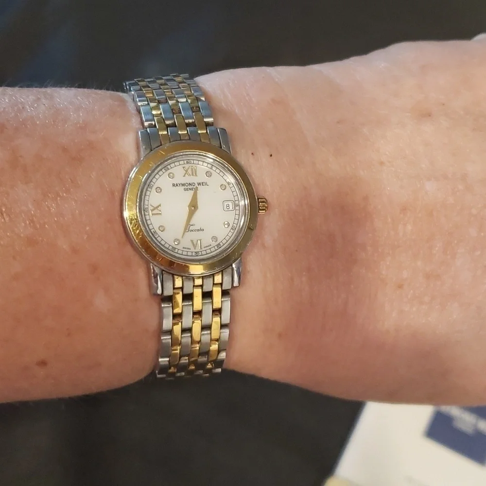Raymond  Weil Toccata woman's watch with pearl face and Diamond accents.